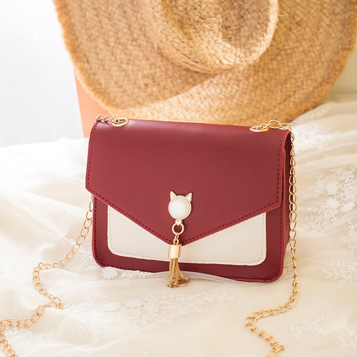 Freya | Small square crossbody bag with cat clasp and tassel