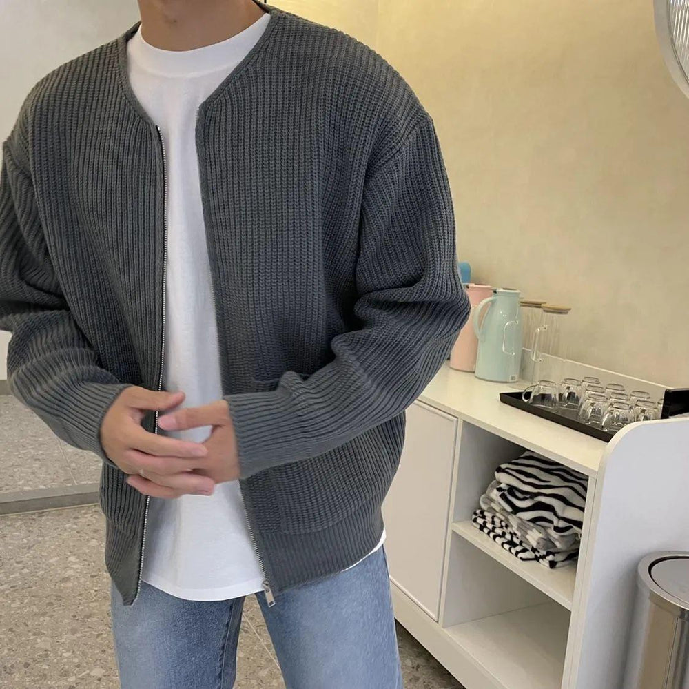 Man wearing a chunky rib knit zip cardigan