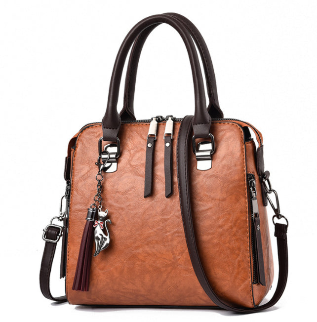 Vintage faux leather handbag with tassel