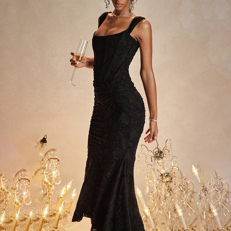 Woman in an off-shoulder ruched maxi dress