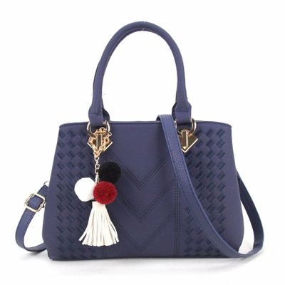Embossed top handle handbag with pompom