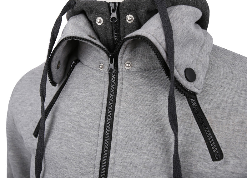 Man in a slim grey zip-up hoodie jacket