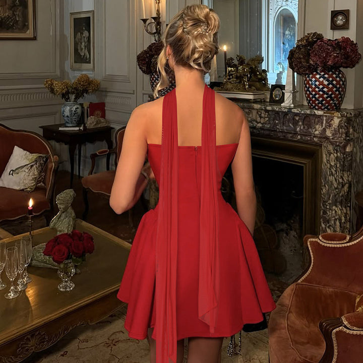 Woman in a strapless mini dress with neck scarf