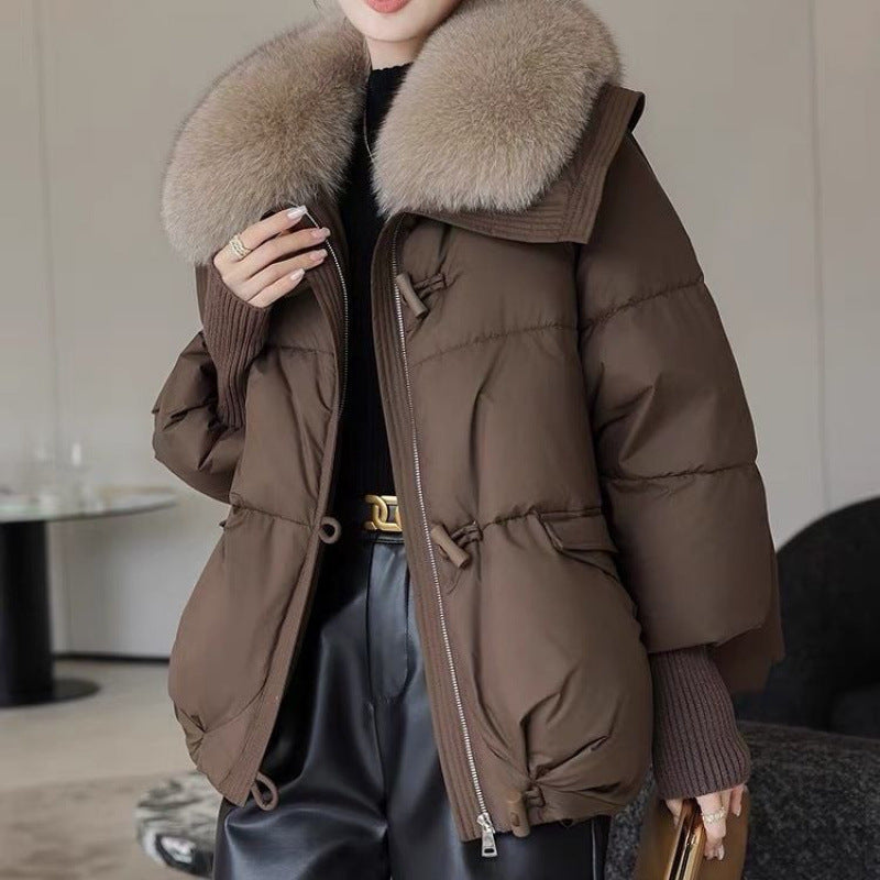 Woman in short puffer jacket with fur collar