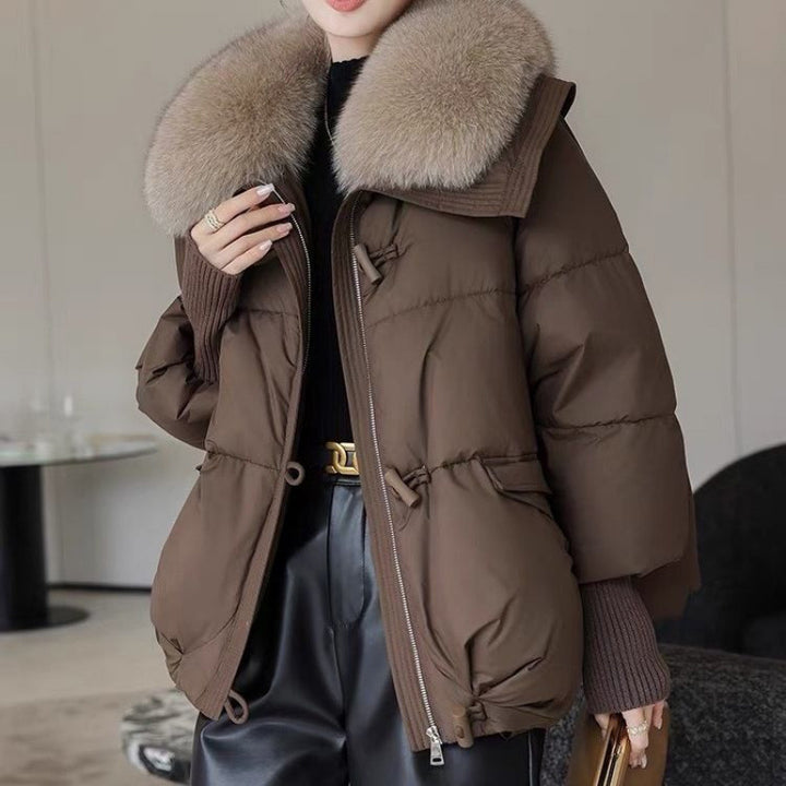 Woman in short puffer jacket with fur collar