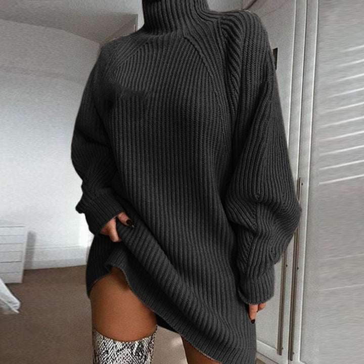 Woman in oversized roll neck jumper dress