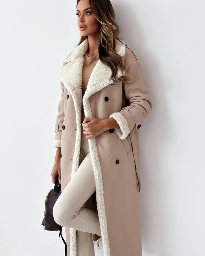 Woman in a long double-breasted belted coat