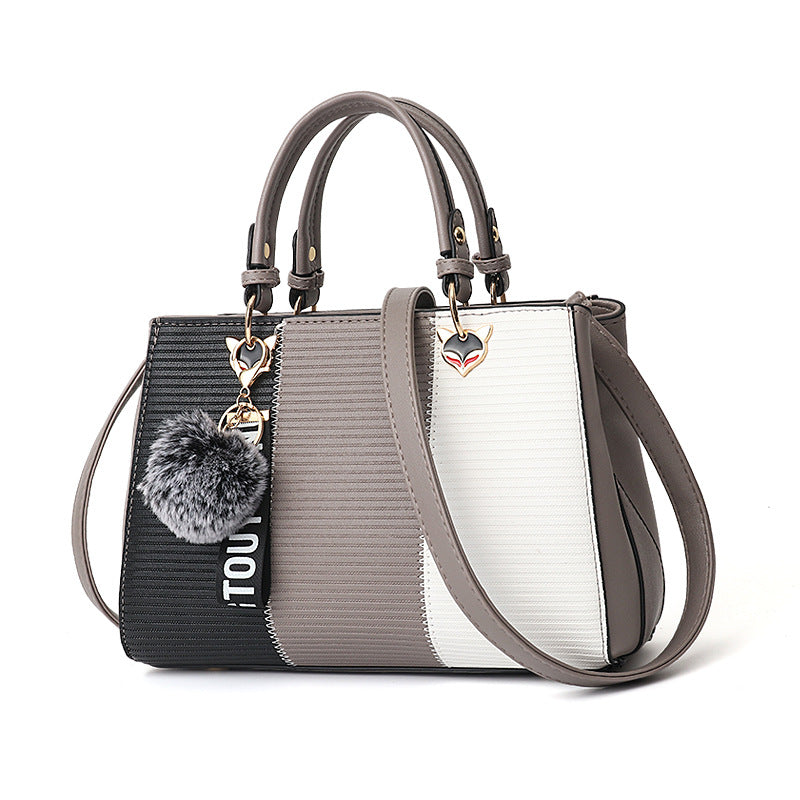 Colour-block handbag with pompom charm