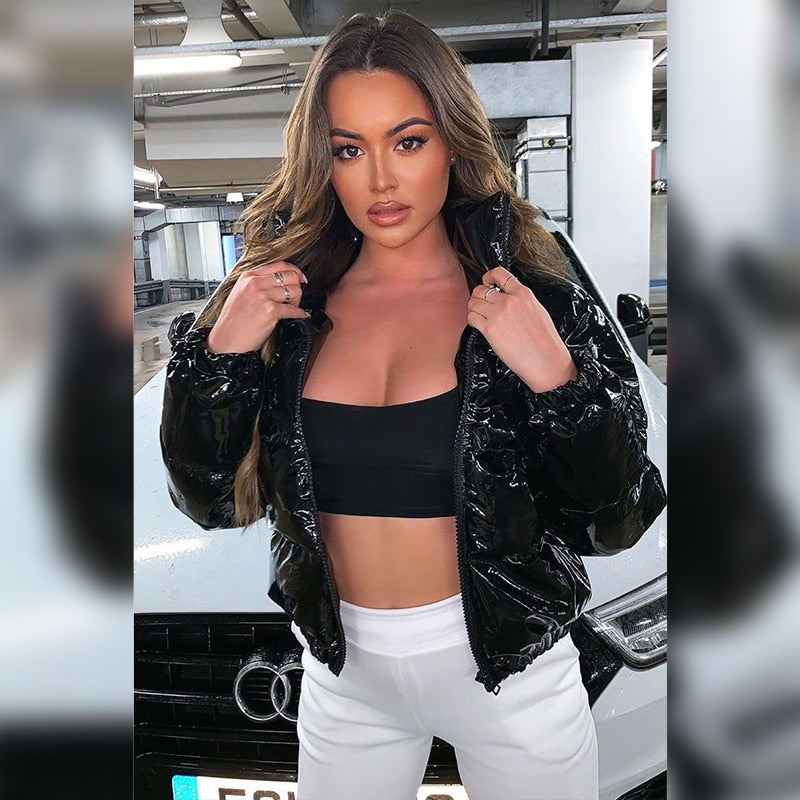 Woman in a glossy cropped puffer jacket