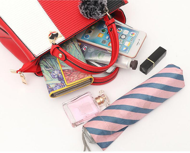 Colour-block handbag with pompom charm
