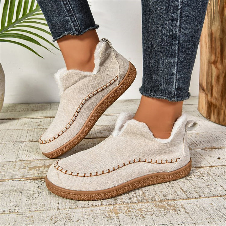 Flat faux suede ankle boots with V-cut