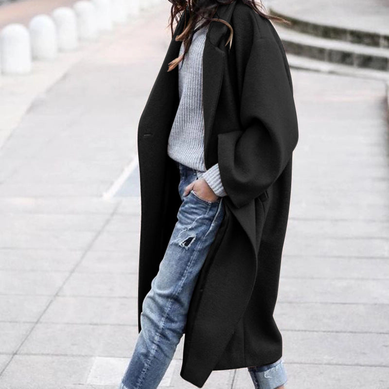 Woman wearing long oversized lapel coat