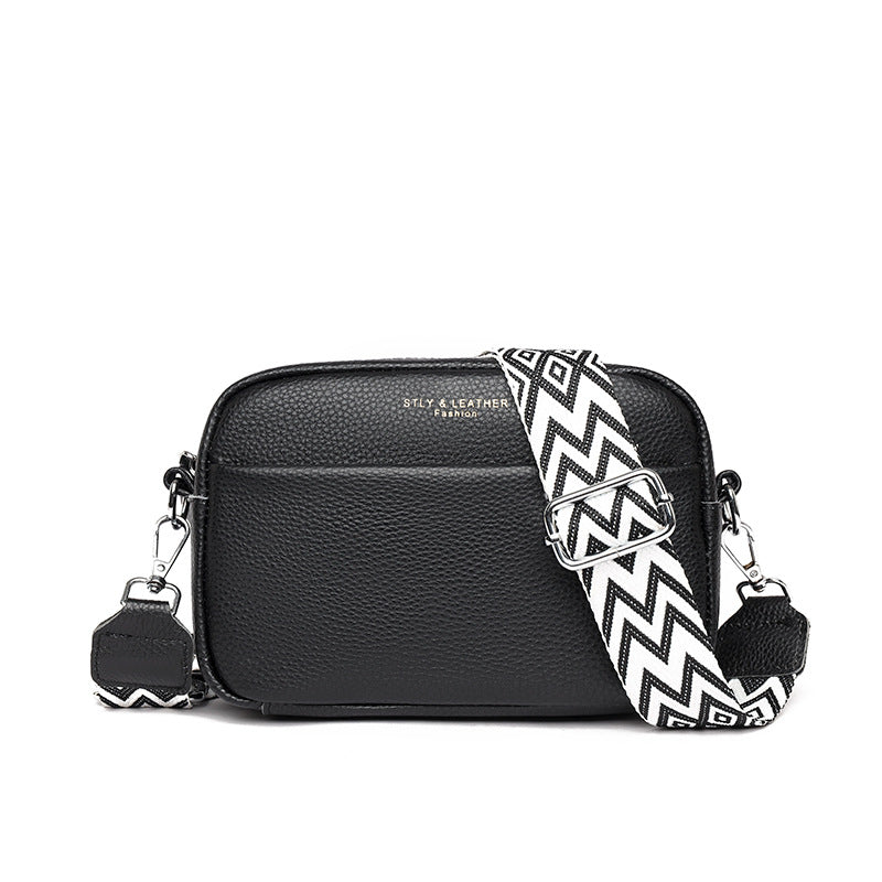 Small leather crossbody bag with patterned strap