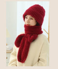 Woman wearing a knitted hood with attached scarf