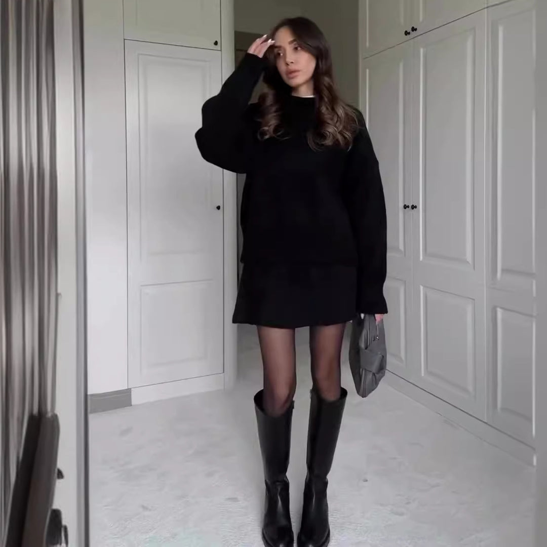 Woman in matching knitted jumper and mini skirt