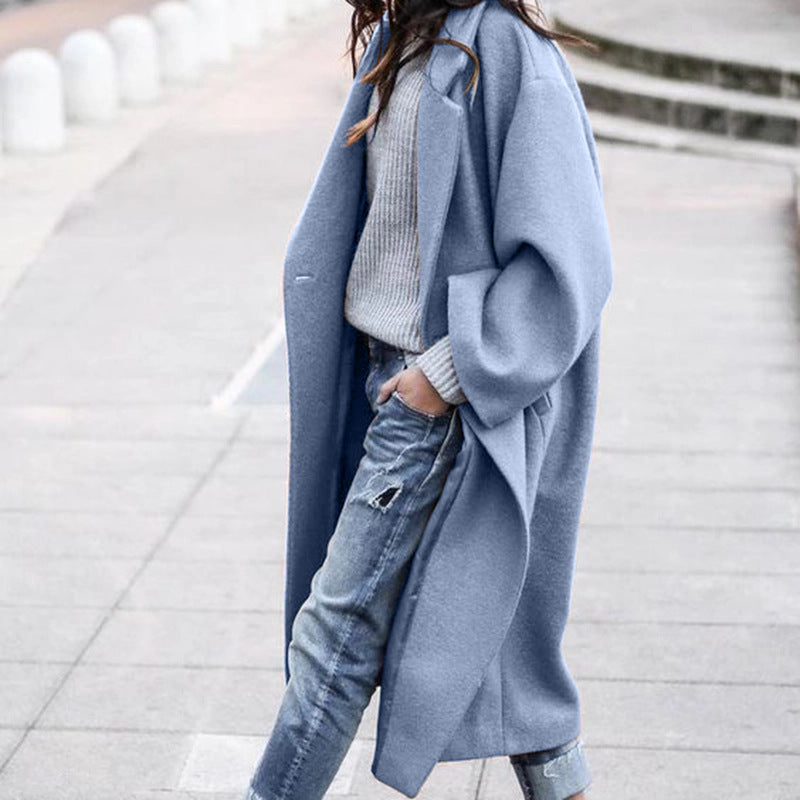 Woman wearing long oversized lapel coat