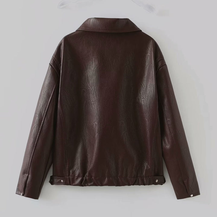Woman in a cropped burgundy faux leather jacket