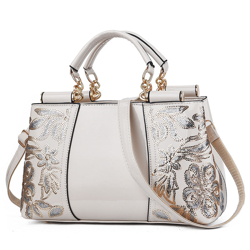 Sequin embroidered patent evening handbag