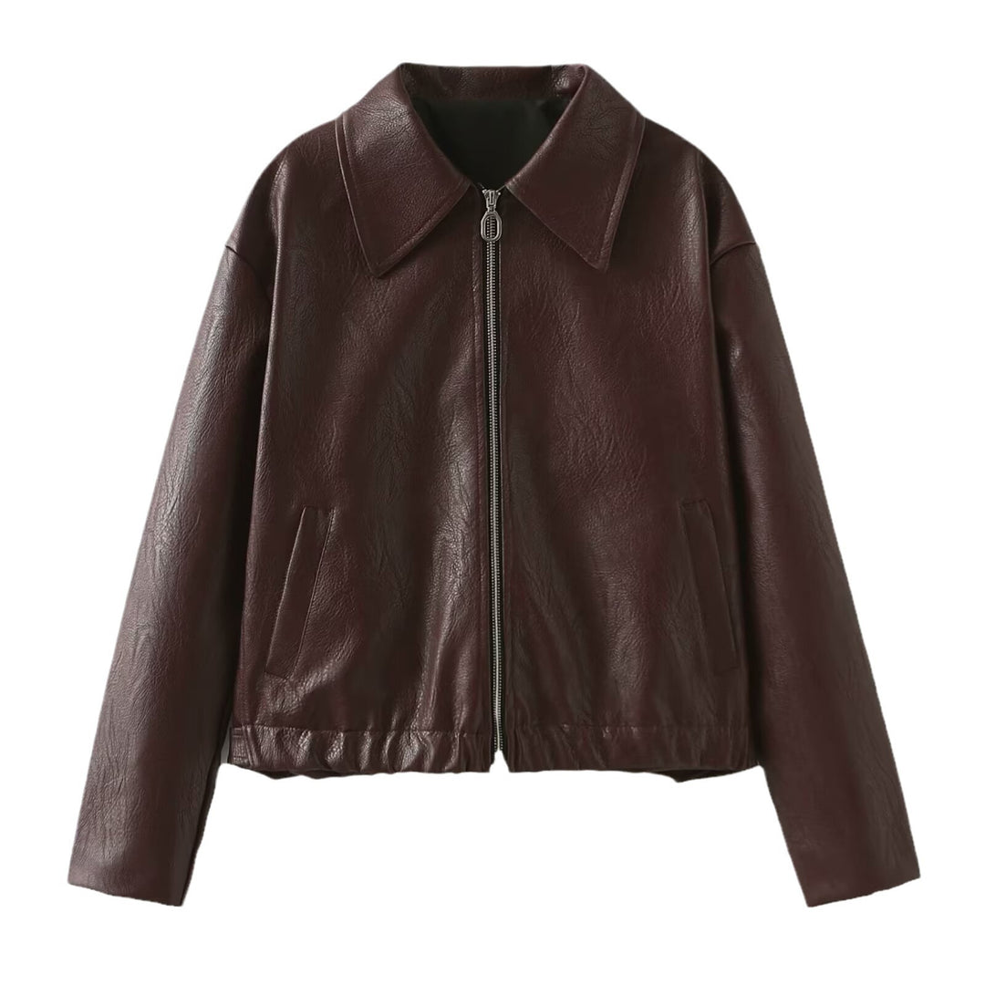 Woman in a cropped burgundy faux leather jacket