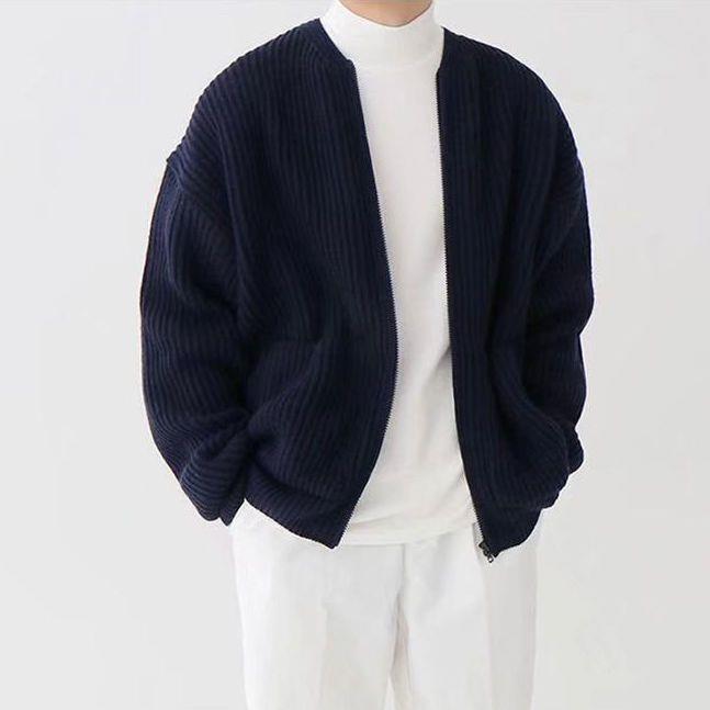 Man wearing a chunky rib knit zip cardigan