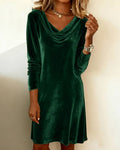 Woman in a velvet cowl-neck mini dress