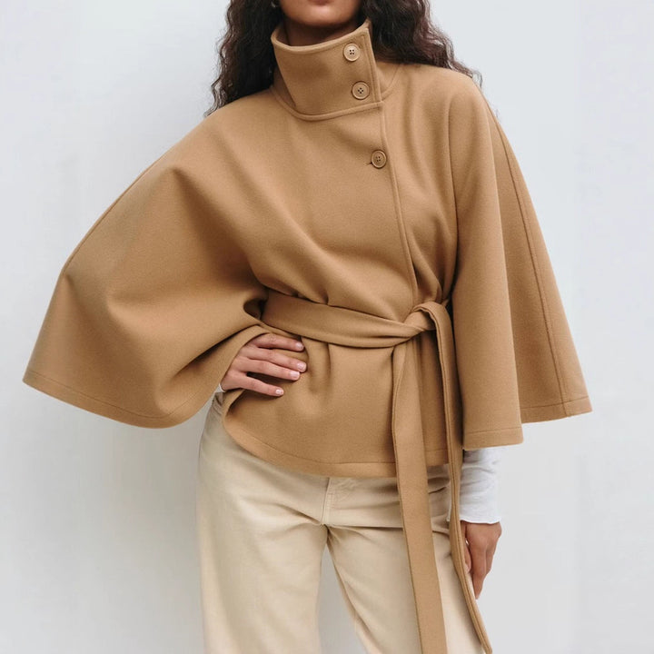 Woman in belted short cape coat