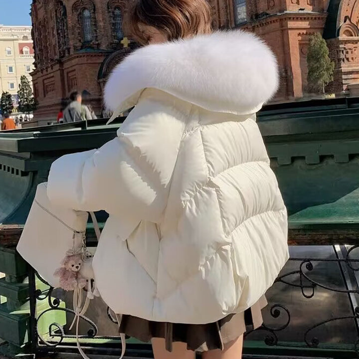 Woman in short puffer jacket with fur collar