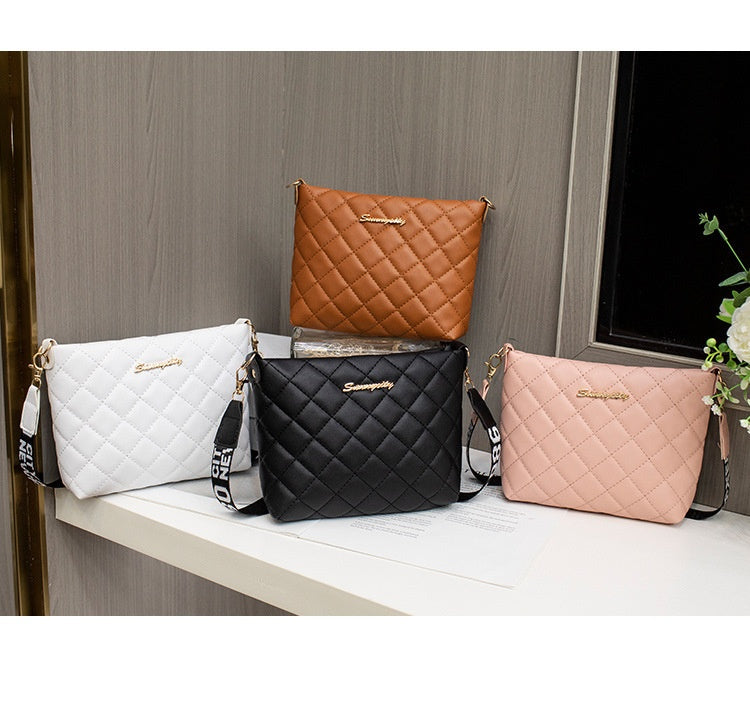Small quilted crossbody bag with wide strap