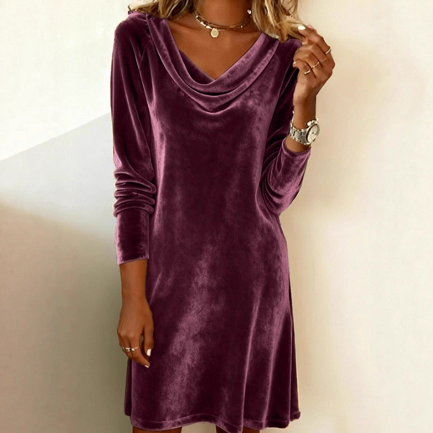 Woman in a velvet cowl-neck mini dress