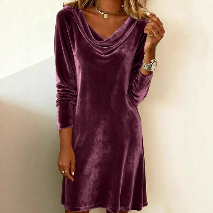 Woman in a velvet cowl-neck mini dress