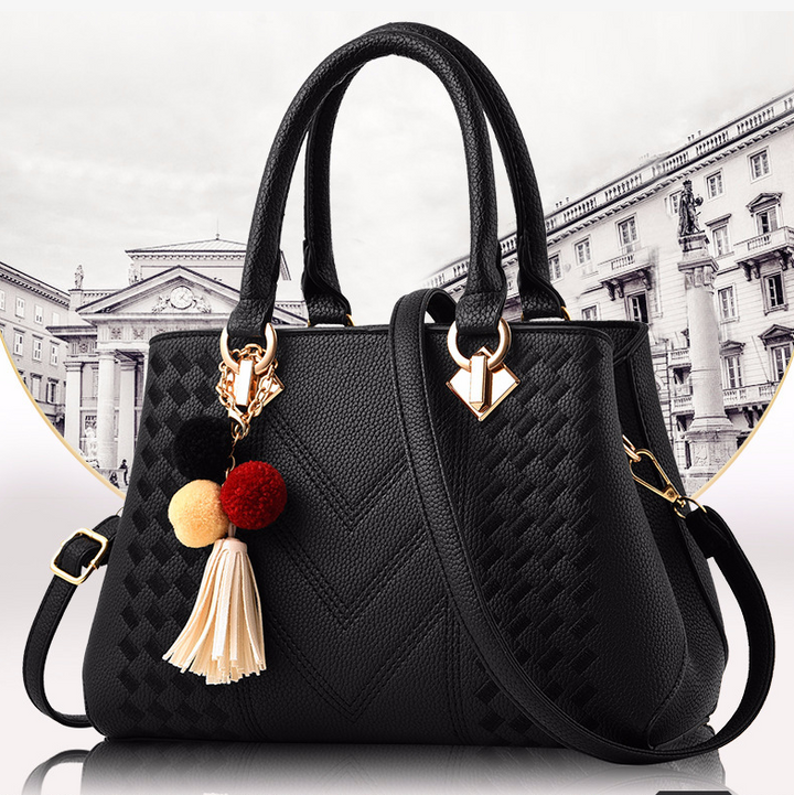 Embossed top handle handbag with pompom
