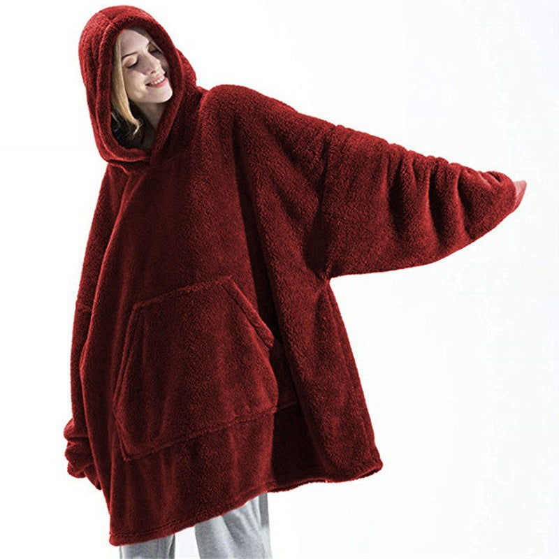 Person relaxing in an oversized blanket hoodie