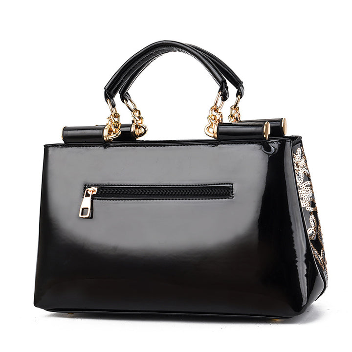 Sequin embroidered patent evening handbag